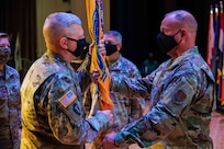 JOINT BASE LANGLEY-EUSTIS, Va. (August 28, 2020) Joint Task Force Civil Support Command Chief Master Sgt. James Brown passes the command flag to outgoing Commanding General Maj. Gen William “Bill” Hall during a change of command ceremony at Joint Base Langley-Eustis Friday, Aug. 28.  Hall relinquished command during the ceremony to Maj. Gen. Jeffrey Van, with U.S. Army North Commanding General Lt. Gen. Laura Richardson as the presiding officer.  The transfer of the unit colors is a long-standing tradition of military units and represents the transfer of authority and responsibility of the command. (U.S. Navy photo by Chief Mass Communication Specialist Barry Riley/RELEASED)