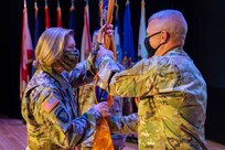 JOINT BASE LANGLEY-EUSTIS, Va. (August 28, 2020) Outgoing Joint Task Force Civil Support Commanding General Maj. Gen. William “Bill” Hall passes the command flag to U.S. Army North Commanding General Lt. Gen. Laura Richardson during a change of command ceremony at Joint Base Langley-Eustis, Friday, Aug. 28.  Hall relinquished command during the ceremony to Maj. Gen. Jeffrey Van, with U.S. Army North Commanding General Lt. Gen. Laura Richardson as the presiding officer.  The transfer of the unit colors is a long-standing tradition of military units and represents the transfer of authority and responsibility of the command. (U.S. Navy photo by Chief Mass Communication Specialist Barry Riley/RELEASED)