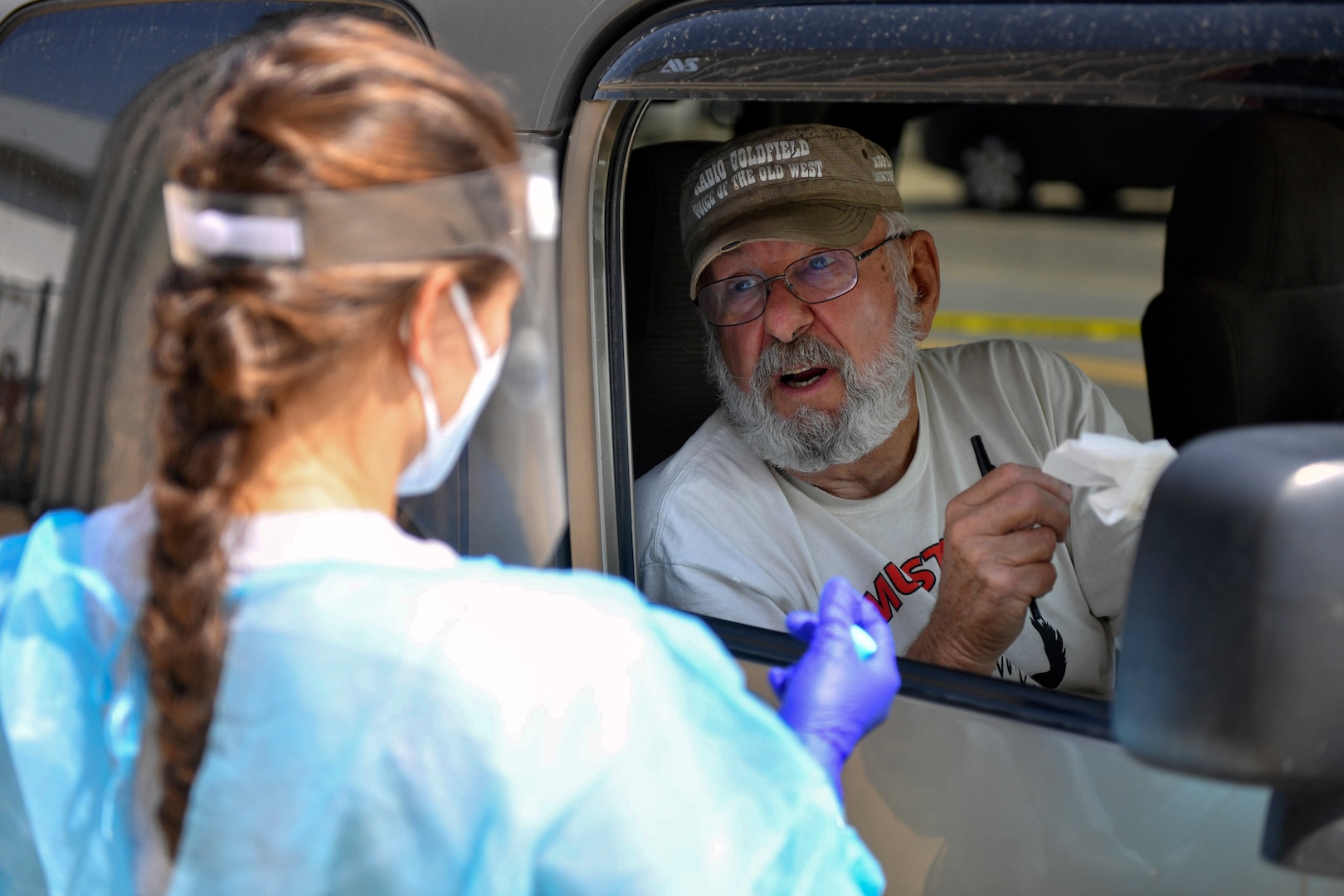 Carl Brownfield of Goldfield, Nevada, drives through a Nevada National Guard community-based collection site for COVID-19 testing at the Silver Peak Emergency Services building in Silver Peak, Nevada, Aug. 27, 2020. The Nevada National Guard ran three COVID-19 test sites in Esmerelda County, the only county in Nevada without a confirmed positive case of the virus.