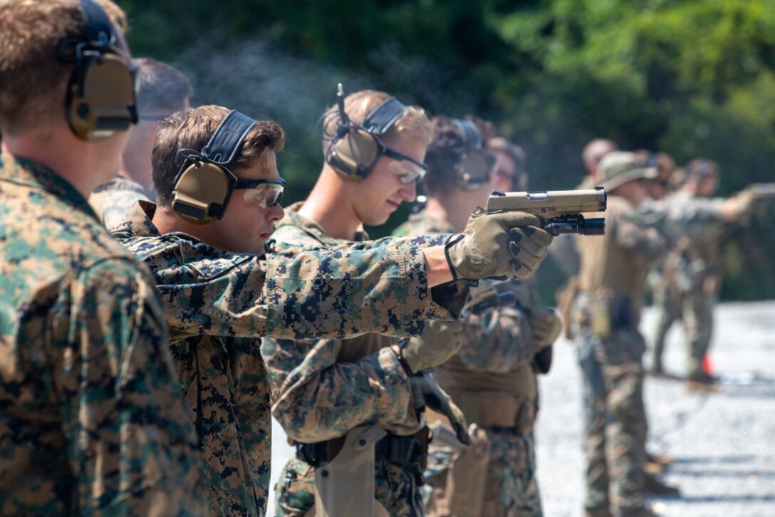 U.S. Marines with 2d Reconnaissance (Recon) Battalion, 2d Marine Division fire M45 1911 A1 pistols on Stone Bay, North Carolina, Aug. 26, 2020. 2d Recon conducted Close Quarters Tactics training to increase lethality of the unit with the M45 1911 A1 pistol at close range.