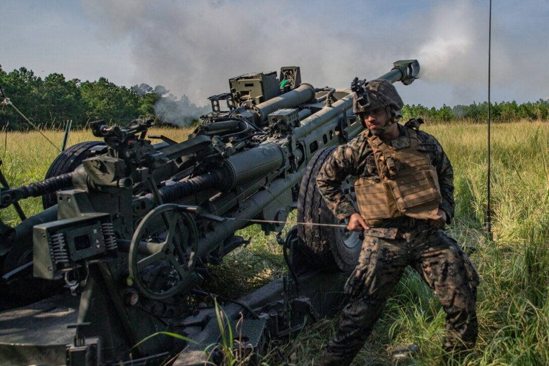 A U.S. Marine with 2nd Battalion, 10th Marine Regiment, 2nd Marine Division fires an M777A2 Howitzer during a live-fire range at Camp Lejeune, North Carolina, Aug. 27, 2020. The live-fire training promotes readiness and combat mindsets for the Marines.