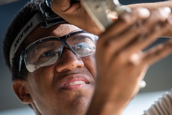 U.S. Air Force Airman 1st Class David Ocasio, a crew chief with the 15th Aircraft Maintenance Unit, removes an MC-130H Combat Talon II panel at Hurlburt Field, Florida, Aug. 25, 2020. Crew chiefs with the 15th AMU are trained to diagnose malfunctions on the Combat Talon II during pre-flight and post-flight inspections, repair and refuel the aircraft, keep detailed records, marshal aircraft and ensure the aircraft are mission ready at all times. (U.S. Air Force photo by Airman 1st Class Blake Wiles)