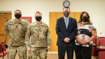 West Virginia National Guard members Sgt 1st Class Timmy Thompson and 2nd Lt. David Parsons of the WVNG's Defensive Cyber Operations Element, pose for a photo with Mr. Joshua Spence, Chief Technology Officer for the State of West Virginia, and Ms. Danielle Cox, Vhief Information Security Officer, West Virginia Office of Technology during a cybersecurity tabletop exercise held in Charleston, West Virginia, August 31, 2020. The 4-day exercise was being held to address cybersecurity threats and respond to attacks to statewide infrastructure within West Virginia. (U.S. Army National Guard photo by Edwin Wriston)