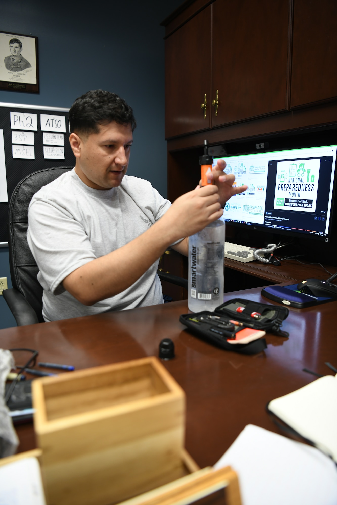 Man with water filter and bottle