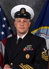 Official portrait of Senior Chief Petty Officer Jason S. Rhodes, the senior enlisted advisor of Tactical Training Group, Atlantic (TTGL).