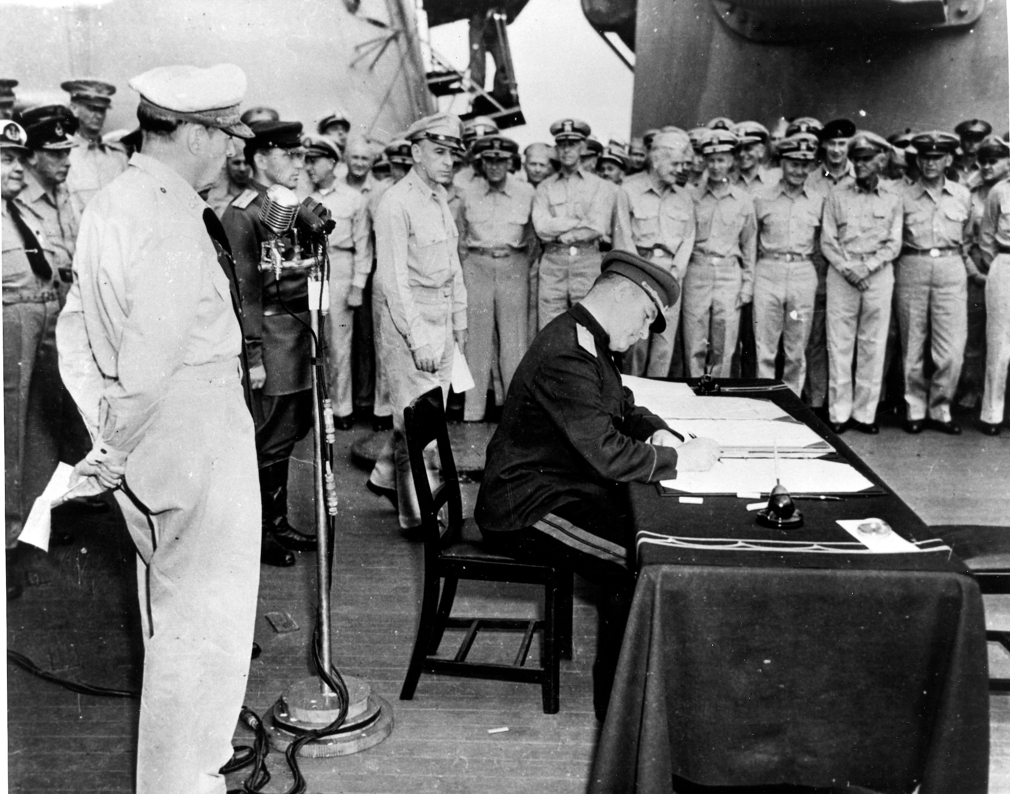 Japanese General Yoshijiro Umezu signs the Japanese Instrument of Surrender onboard the USS Missouri, Sept. 2, 1945.