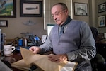 Gary W. Boyd, Air Education and Training Command historian, reads through documents of the formation of Randolph Field July 28, 2020 at Joint Base San Antonio-Randolph, Texas. A respected researcher and writer of history, Boyd has lived through several significant periods of history—all of which he believes has determined our present and shapes our future.