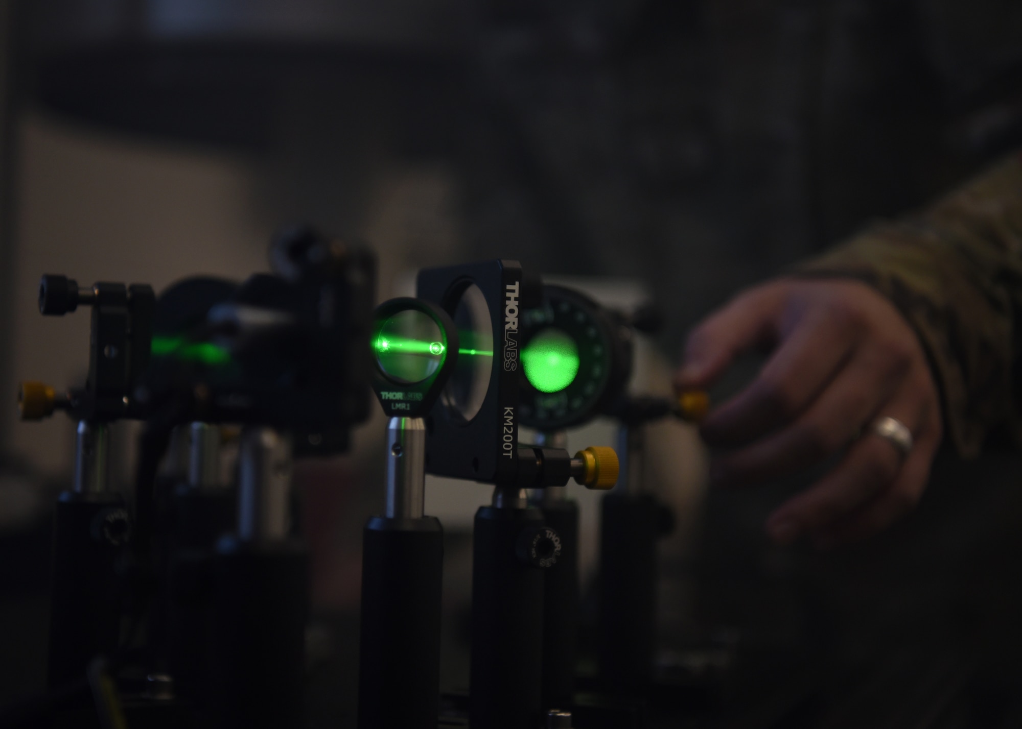 U.S. Air Force Tech. Sgt. David Hunt, 312th Training Squadron Special Instruments Training course instructor, aligns the laser in the interferometer to demonstrate light technologies for the SPINSTRA students, inside the Louis F. Garland Department of Defense Fire Academy on Goodfellow Air Force Base, Texas, Aug. 19, 2020. Hunt demonstrated how light photons could act like either a wave or a particle, known as the duality of light. (U.S. Air Force photo by Senior Airman Abbey Rieves)