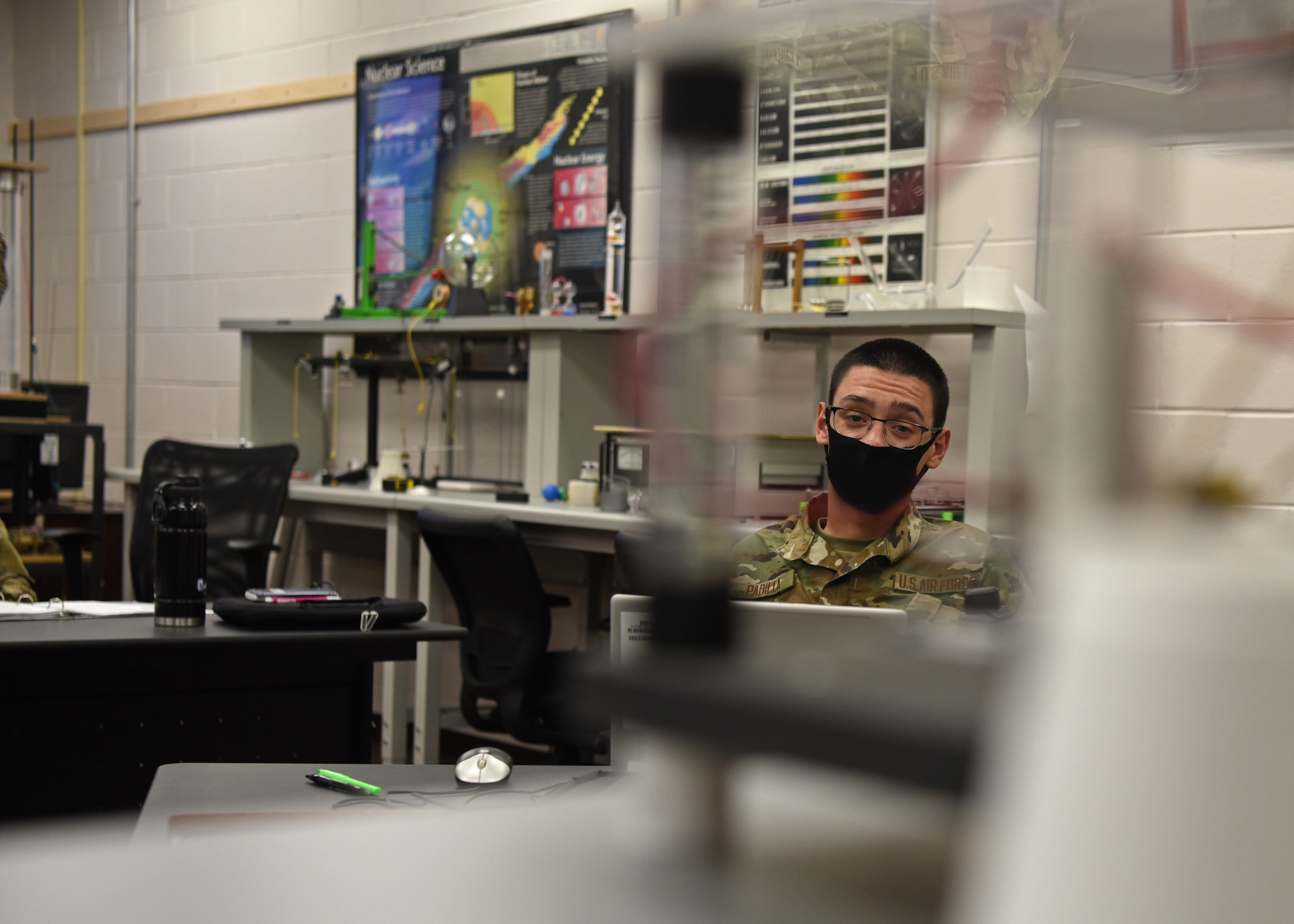 U.S. Air Force Airman Christian Padilla, 312th Training Squadron Special Instruments Training course student, observes an electrical resonant transformer circuit, more commonly known as a TESLA coil, during a scientific demonstration, in the Louis F. Garland Department of Defense Fire Academy on Goodfellow Air Force Base, Texas, Aug. 19, 2020. The SPINSTRA course lasted 85 training days and taught electronic principles, applied sciences, computer and network fundamentals, phenomenology, and Intelligence, Surveillance, and Reconnaissance fundamentals in a 10:1 student to instructor classroom ratio. (U.S. Air Force photo by Senior Airman Abbey Rieves)