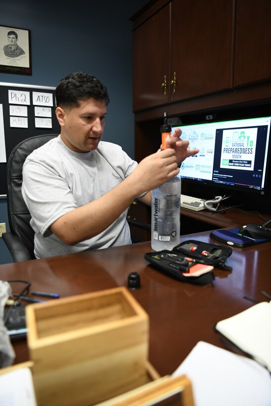 Man with water filter and bottle
