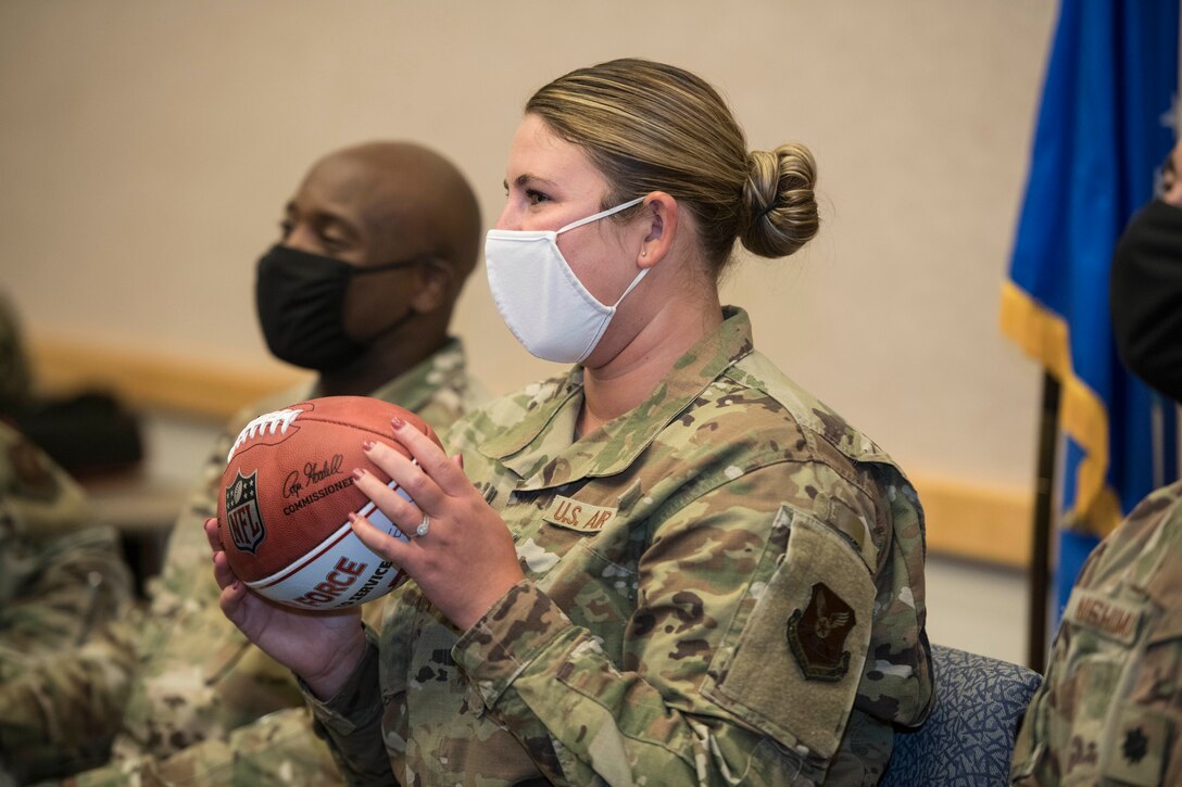 Staff Sgt. Brooke Garibay, a 509th Logistics Readiness Squadron training manager, displays her Kansas City Chiefs Salute to Service football, during a Chiefs virtual military appreciation video call at Whiteman Air Force Base, Missouri, Aug. 27, 2020. The Chiefs chose Garibay based on her mission contribution and her dedication as a football fan for the event. (U.S. Air Force photo by Senior Airman Thomas Johns)