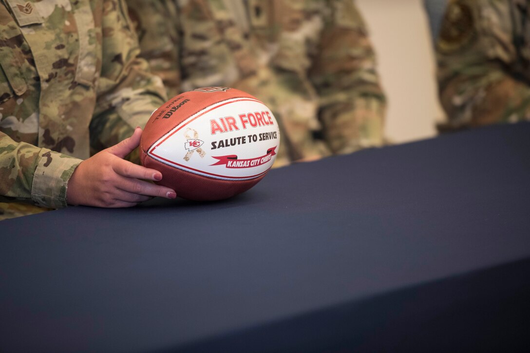 Staff Sgt. Brooke Garibay, a 509th Logistics Readiness Squadron training manager, displays her Kansas City Chiefs Salute to Service football, during a Chiefs virtual military appreciation video call at Whiteman Air Force Base, Missouri, Aug. 27, 2020. Garibay participated in a video call with other U.S. military branches who had an opportunity to ask questions and spend time with former Chiefs linebacker, Shawn Barber. (U.S. Air Force photo by Senior Airman Thomas Johns)