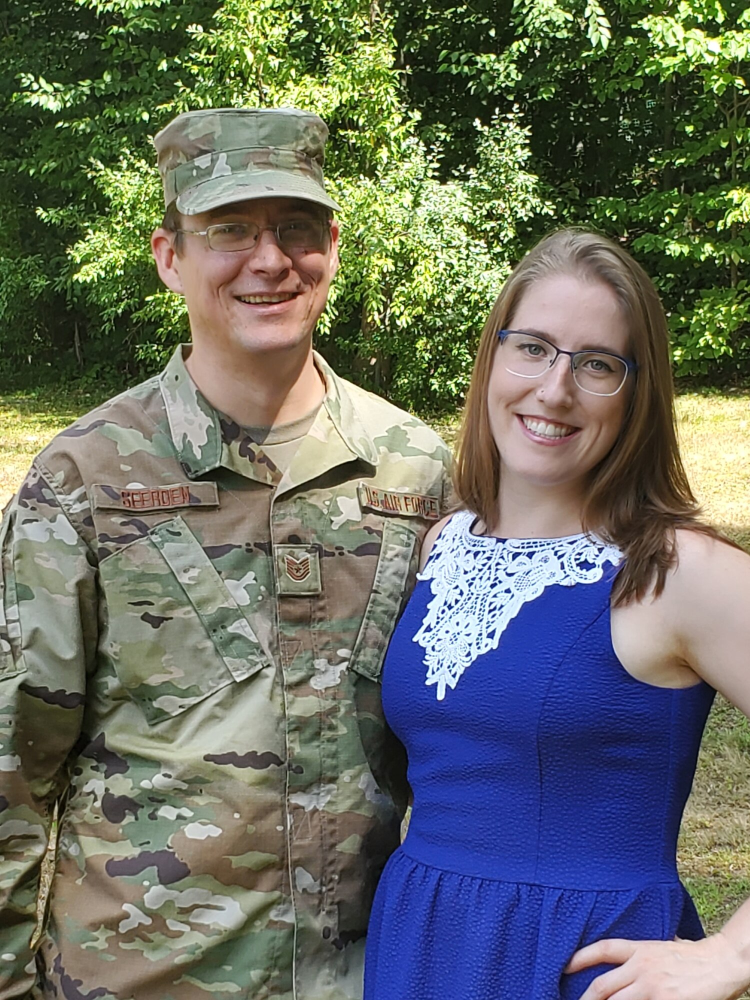 Tech. Sgt. George Seerden, 960th Cyberspace Operations Group NCO in charge of Standards and Evaluations, stands next to his significant other, Janelle, in his backyard Aug. 1, 2020, Johnston, Rhode Island. (Courtesy photo by Justine Boucher)