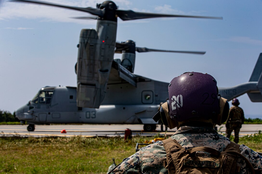 U.S. Marine Corps Cpl. Federico Jaramillo, a pump operator with Marine Wing Support Squadron (MWSS) 172, waits to help refuel an MV-22 Osprey in support of assault support aircraft from 1st Marine Aircraft Wing during Operation Lightning Strike, Aug. 6, 2020, at Ie Shima Training Facility, Okinawa, Japan. The purpose of the training was to prepare Prospective Weapons and Tactics Instructor (PWTI) students for what to expect when they attend future WTI courses. MWSS 172’s role was to provide the Forward Arming and Refueling Point to expand the combat radius and allow aviation ground support closer to the objective. (U.S. Marine Corps photo by Lance Cpl. Karis Mattingly)