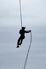A U.S. Marine with III Marine Expeditionary Force (III MEF), Expeditionary Operation Training Group (EOTG), conducts helicopter rappel training at Camp Hansen, Okinawa, Japan, Oct. 23, 2020. EOTG trains Marines before being attached to Marine Expeditionary Units, where they will conduct operations using multiple techniques for tactical insertions. (U.S. Marine Corps photo by Lance Cpl. Dalton J. Payne)