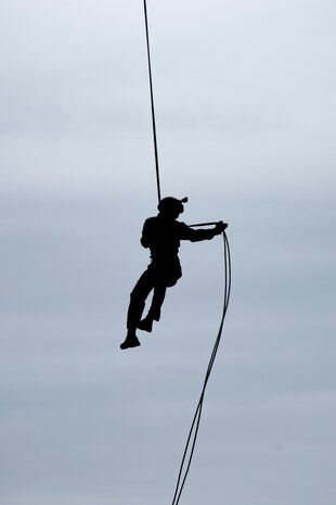 A U.S. Marine with III Marine Expeditionary Force (III MEF), Expeditionary Operation Training Group (EOTG), conducts helicopter rappel training at Camp Hansen, Okinawa, Japan, Oct. 23, 2020. EOTG trains Marines before being attached to Marine Expeditionary Units, where they will conduct operations using multiple techniques for tactical insertions. (U.S. Marine Corps photo by Lance Cpl. Dalton J. Payne)
