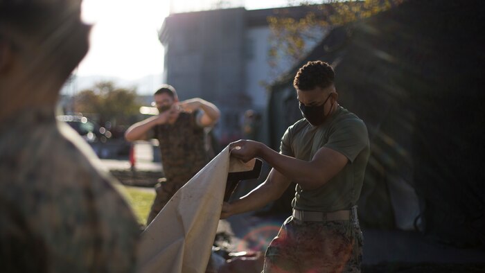 U.S. Marines with Marine Wing Support Squadron (MWSS) 171 assemble the combat operations center (COC) during Exercise Active Shield aboard Marine Corps Air Station Iwakuni, Japan, Oct. 26, 2020. Marines with MWSS-171 assembled the COC to provide security operations during the exercise. Active Shield is an annual bilateral exercise partnering U.S. and Japanese forces for the protection and defense of MCAS Iwakuni and other assets in the region in order to sustain military operations in support of the U.S.-Japan Alliance. (U.S. Marine Corps photo by Lance Cpl. Bryant Rodriguez)