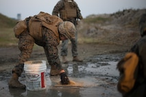 U.S Marines with Marine Wing Support Squadron 171 repair damage to a concrete slab that simulates damage to an airfield during Exercise Active Shield aboard Marine Corps Air Station (MCAS) Iwakuni, Japan, Oct. 29, 2020. Active Shield is an annual bilateral exercise partnering U.S. and Japanese forces for the protection and defense of MCAS Iwakuni and other assets in the region in order to sustain military operations in support of the U.S.-Japan Alliance. (U.S. Marine Corps photo by Lance Cpl. Bryant Rodriguez)