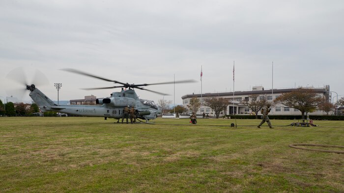 U.S. Marines with Marine Wing Support Squadron (MWSS) 171 refuel an AH-1Z Viper helicopter with Marine Light Attack Helicopter Squadron (HMLA) 469 in support of Exercise Active Shield aboard Marine Corps Air Station (MCAS) Iwakuni, Japan, Oct. 28. 2020. The Marines of MWSS-171 converted the parade field of MCAS Iwakuni into a landing zone and forward arming and refueling point to support sustained operations. Active Shield is an annual bilateral exercise partnering U.S and Japanese forces for the protection and defense of MCAS Iwakuni and other assets in the region in order to sustain military operations in support of the U.S.-Japan Alliance.  (U.S. Marine Corps photo by Lance Cpl. Tyler Harmon)