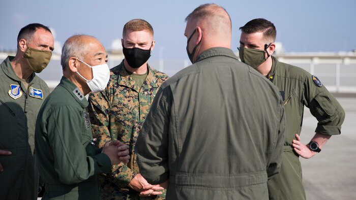 Lt. Gen. Hiroshi Kaminotani, Japan Air Defense Command Vice Commander (second from left) and U.S. Air Force Brig. Gen. Leonard Kosinski, vice commander, Fifth Air Force (left) speak with U.S. Marine Corps Lt. Col. Michael Wyrsch, commanding officer of Marine Fighter Attack Squadron 242, aboard Marine Corps Air Station (MCAS) Iwakuni, Japan, Nov. 17, 2020. The visit enabled U.S. and Japanese military leaders to continue to build upon strong relationship and maintain mutual understanding of strategically placed aviation capabilities in the Pacific. (U.S. Marine Corps photo by Lance Cpl. Bryant Rodriguez)