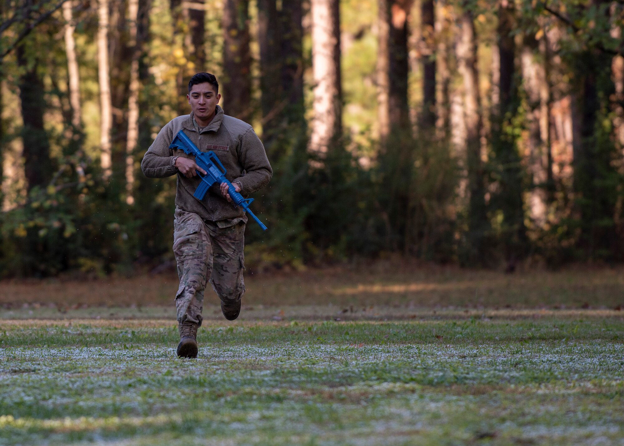 Staff Sgt. Jose Flores, 4th Civil Engineer Squadron pavement and equipment operator, runs across a field during Prime Base Engineer Emergency Force training at Seymour Johnson Air Force Base, North Carolina, Nov. 19, 2020.