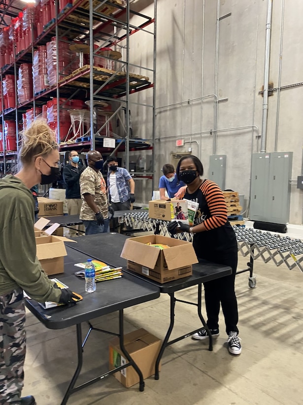 Jennifer Flores, NSA-Texas chief of Policy, and Alicia Butler, NSA-Texas Higher Ed lead, help fill boxes.