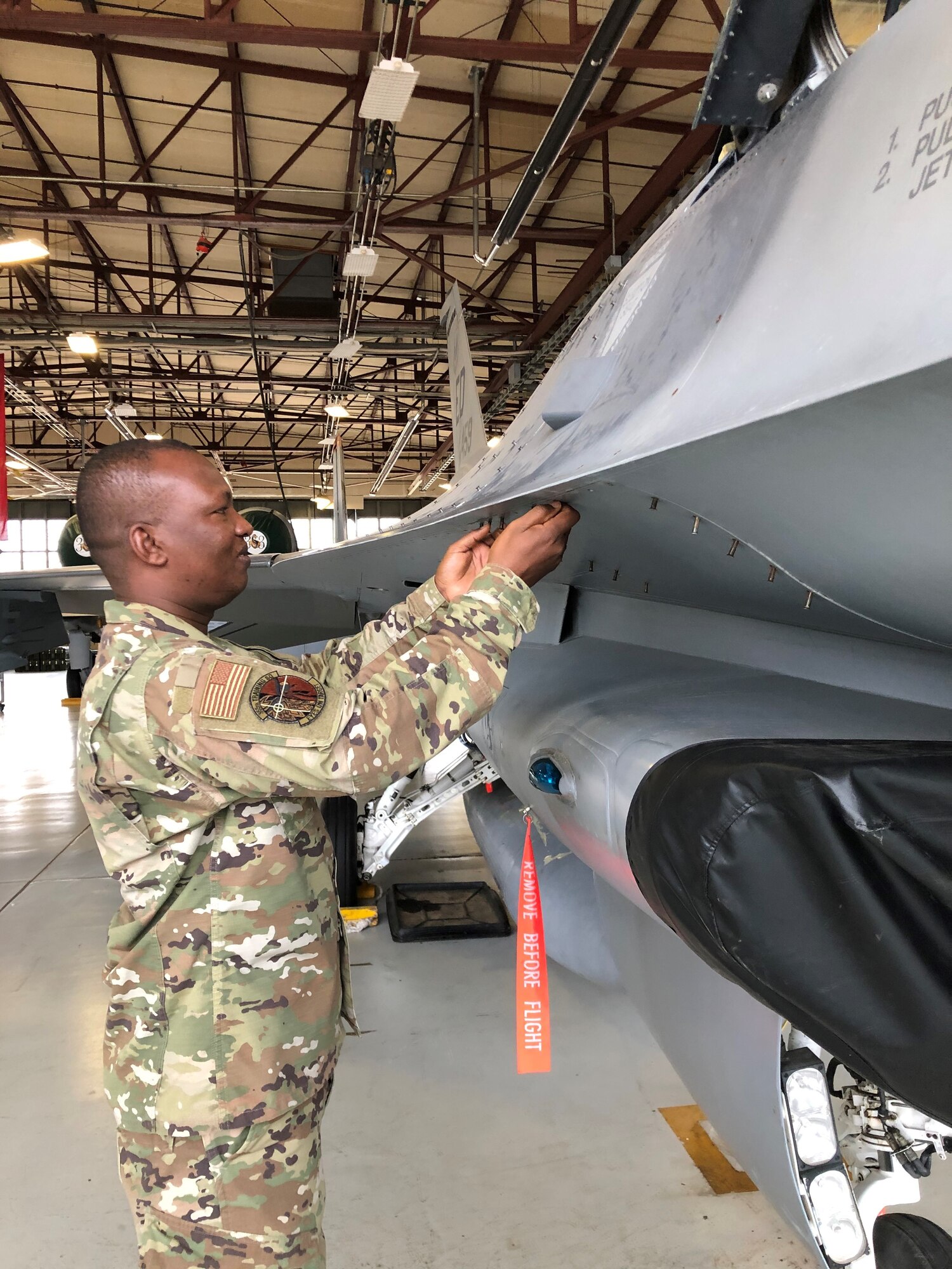 Airman 1st Class Yacouba Ky, 365th Training Squadron F-16 avionics journeyman course graduate, works on an F-16 Fighting Falcon trainer at Sheppard Air Force Base, Texas, Nov. 24, 2020. Ky earned the ACE award in the course, that means he did not miss a single question in any test during his nine blocks of training. (Courtesy Photo)