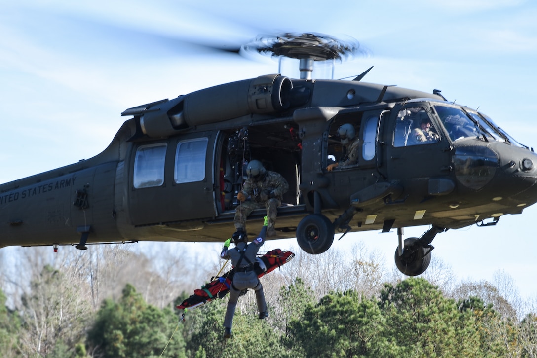 Virginia National Guard flight crews train with Chesterfield County Fire and Emergency Medical Services Scuba Rescue Team members on rescue hoist operations Nov. 19, 2020, in Chesterfield, Virginia. Together, the Virginia aviators and Chesterfield first responders form the Virginia Helicopter Aquatic Rescue Team, or HART. Their training focused on conducting litter hoists and is part of an ongoing partnership that first began in 2011.