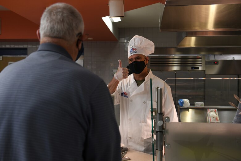 Col. Anthony Mastalir, 30th Space Wing commander, serves Thanksgiving meals to service members and base members at the Breakers Dining Facility Nov. 26, 2020, at Vandenberg Air Force Base, Calif.