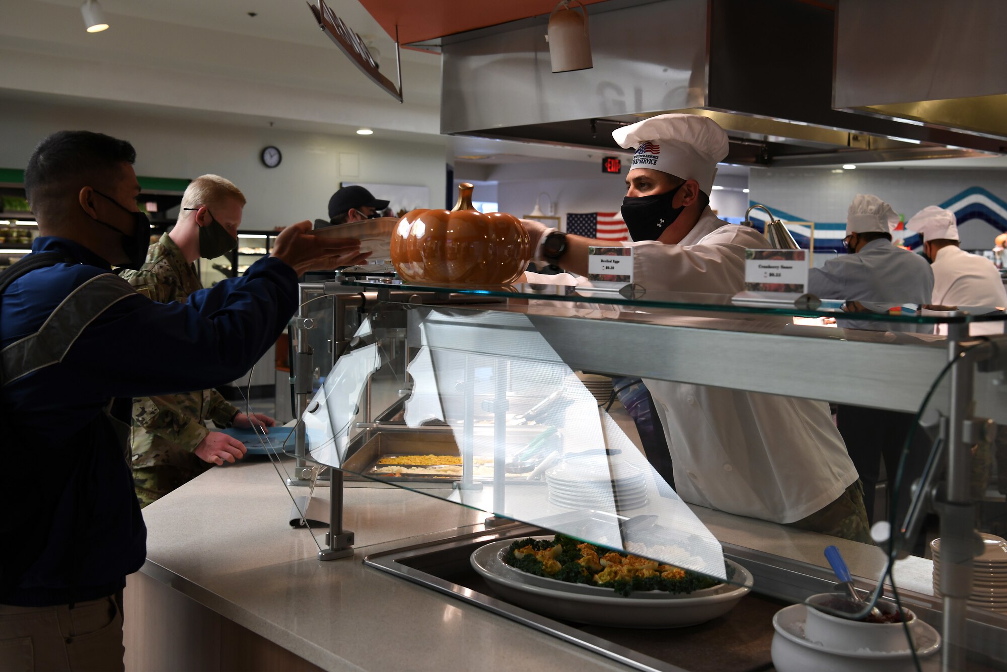 Chief Master Sgt. Jason Delucy, 30th SW command chief, serves Thanksgiving meals to service members and base members at the Breakers Dining Facility Nov. 26, 2020, at Vandenberg Air Force Base, Calif.
