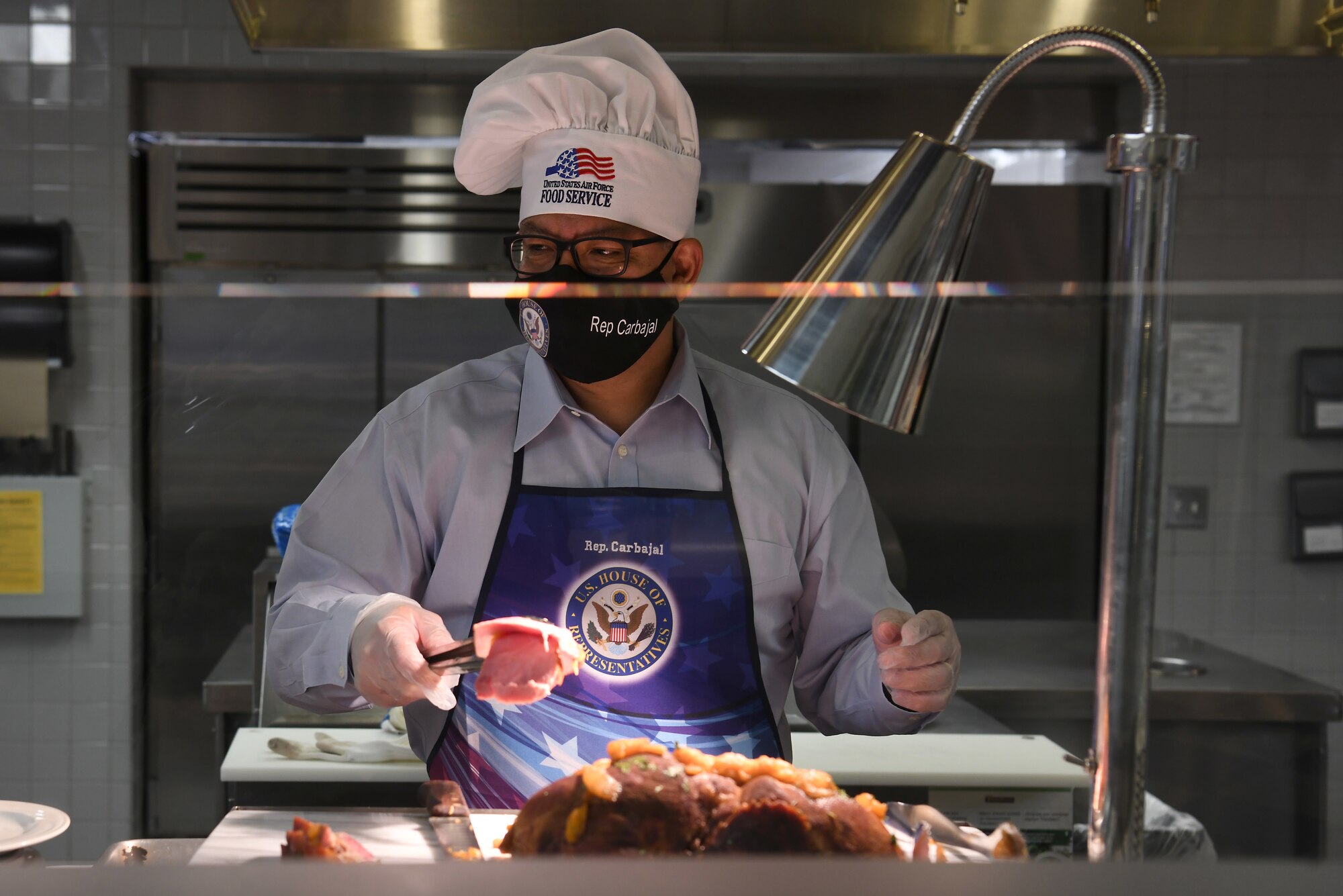 Rep. Salud Carbajal, United States Congressman, serves Thanksgiving meals to military and base members at the Breakers Dining Facility Nov. 26, 2020, at Vandenberg Air Force Base, Calif.