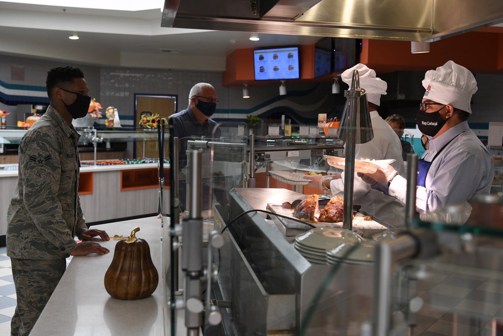 Base leadership, and Rep. Salud Carbajal,United States  Congressman, serve Thanksgiving meals to service members and base members at the Breakers Dining Facility Nov. 26, 2020, at Vandenberg Air Force Base, Calif.