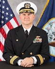 Studio portrait of Cmdr. Brett Litchfield.