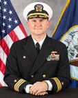 Studio portrait of Cmdr. Brett Litchfield.