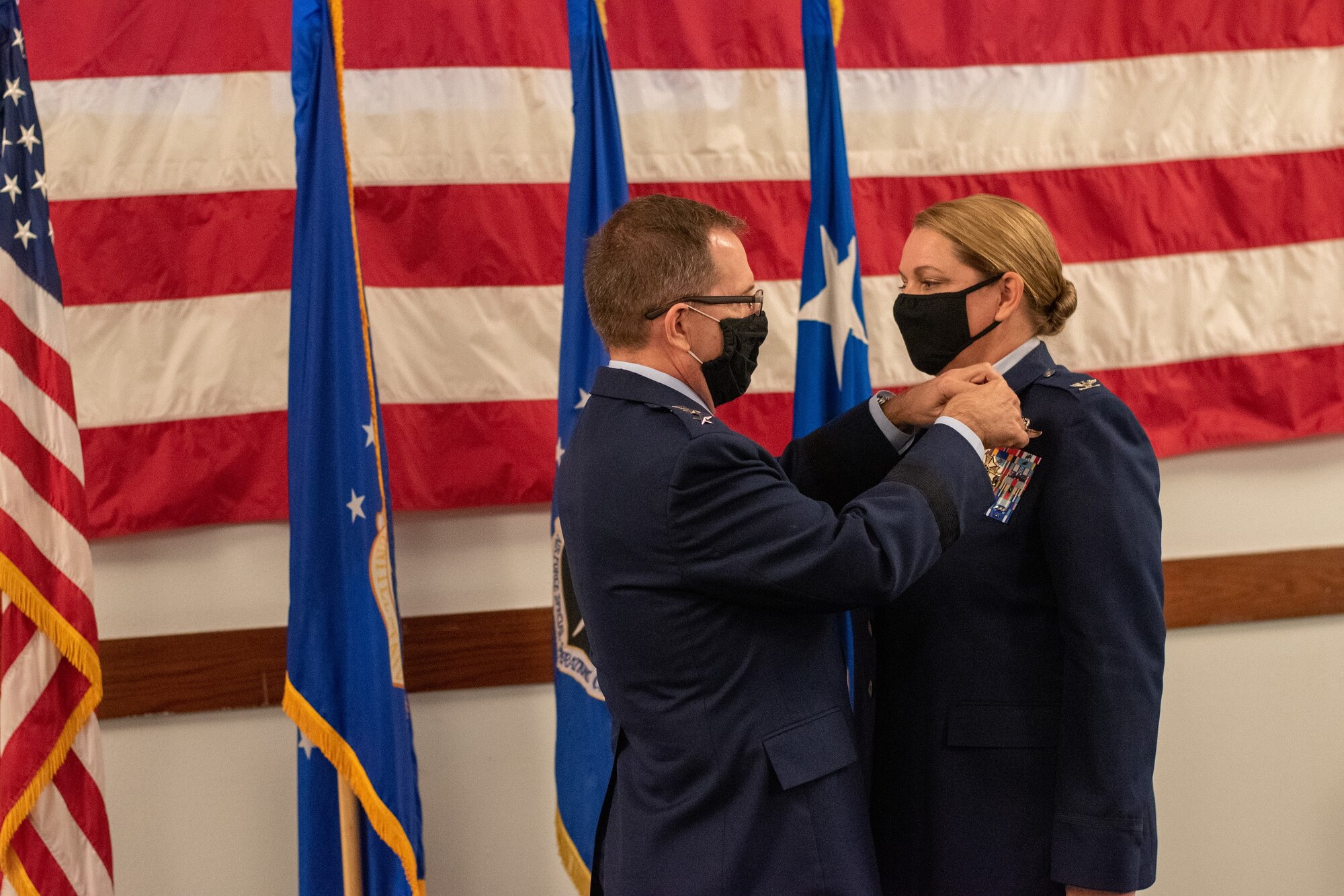 U.S. Air Force Lt. Gen. Jim Slife, commander of Air Force Special Operations Command, pins the Legion of Merit on U.S. Air Force Col. Shelley Woodworth during her retirement ceremony on Nov. 23, 2020. Woodworth was the first female AFSOC pilot and retired with 3,500 flying hours.
