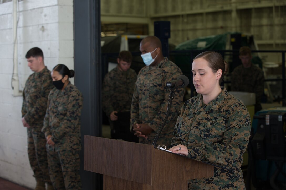 U.S. Navy Lt. Ailsa Harl, the Marine Corps Air Station (MCAS) Cherry Point, North Carolina, station chaplain, says a prayer during a relief and appointment ceremony at MCAS Cherry Point, North Carolina, Nov. 6, 2020. The ceremony was held to transition the position of Headquarters and Headquarters Squadron sergeant major from Sgt. Maj. Thomas J. Korabik Jr. to Sgt. Maj. James I. Petty. (U.S. Marine Corps photo by Lance Cpl. Jacob Bertram)