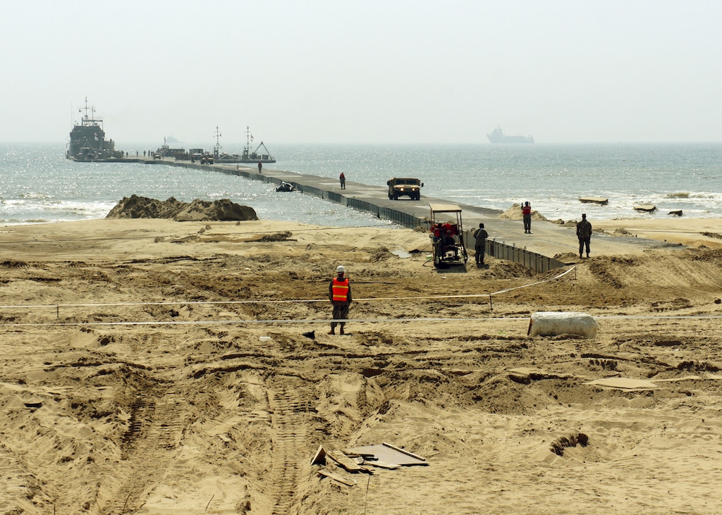 A U.S. Army Landing Craft Utility 2000 offloads equipment to a Trident Pier at Anmyeon Beach on the west coast of the Republic of Korea during exercise Combined Joint Logistics Over-the-Shore (LOTS) 2015.  CJLOTS 2015 is an exercise designed to train U.S. and ROK service members to accomplish vital logistical measures in a strategic area while strengthening communication and cooperation in the U.S.-ROK alliance.