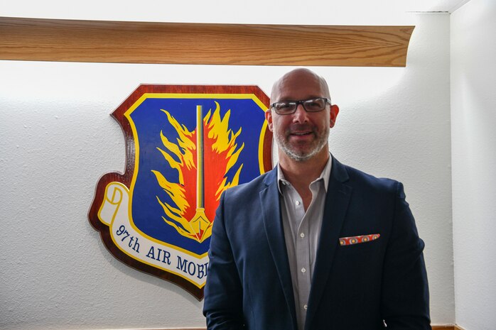 group of people stand by building