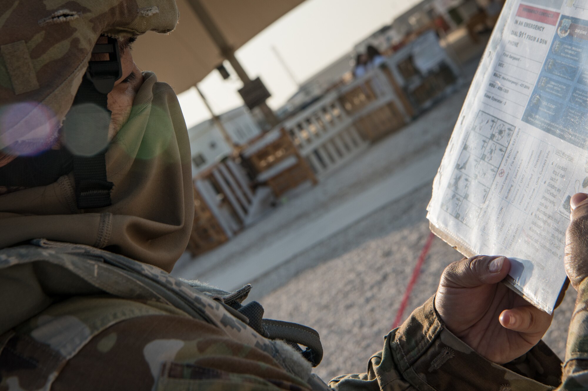 An Airman looks at an instruction sheet