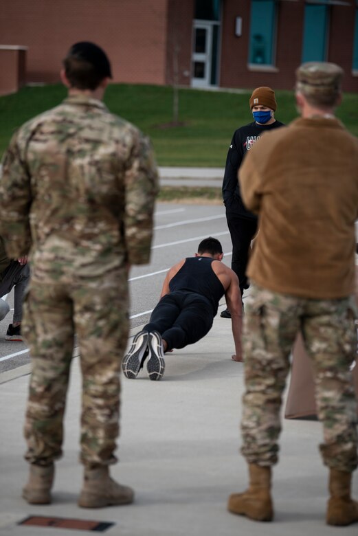 Candidate does push ups