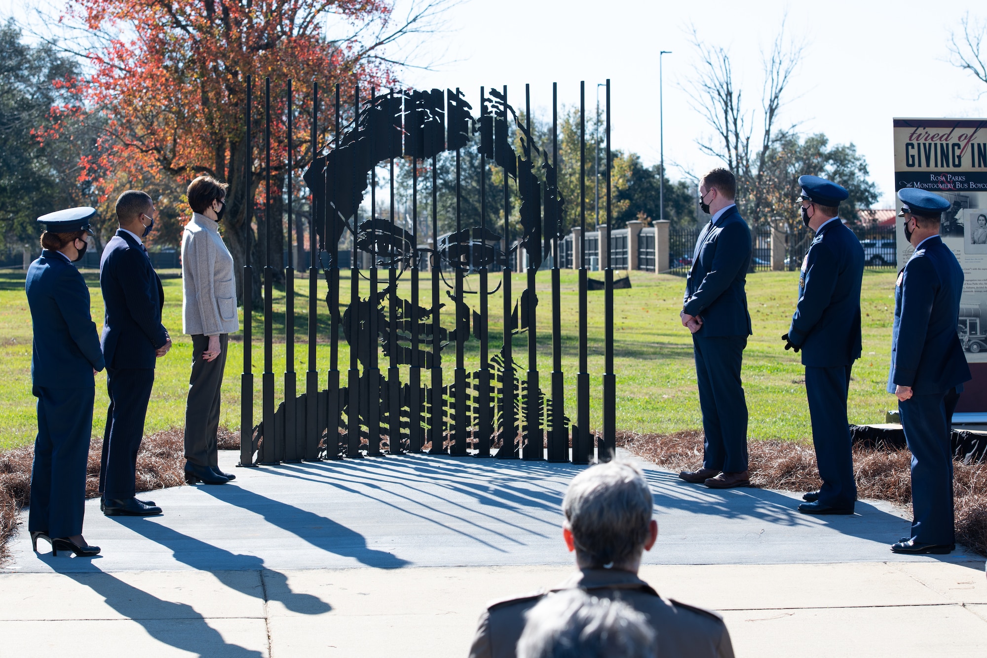 Col. Eries Mentzer, 42nd Air Base Wing commander, is joined by Secretary of the Air Force Barbara Barrett and other distinguished visitors Dec. 1, 2020, for the unveiling of a Rosa Parks memorial sculpture. Many people may know of the work Rosa Parks did during the civil rights movement, but less may know she worked on Maxwell Air Force Base in the 1940s. (U.S. Air Force photo by Senior Airman Charles Welty)