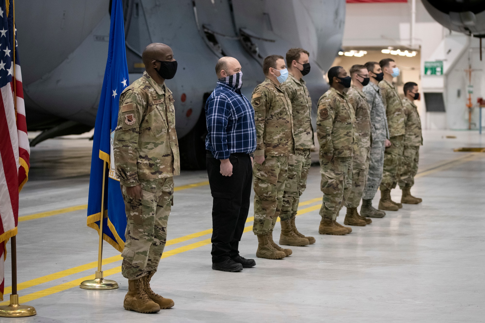 U.S. Air Force Col. Travolis A. Simmons, the commander of the 3rd Wing, awards Joint Service Achievement Medals to Airmen from the 3rd Maintenance Squadron for their participation in the recovery effort during Operation Colony Glacier at Joint Base Elmendorf-Richardson, Alaska, Nov. 30, 2020.