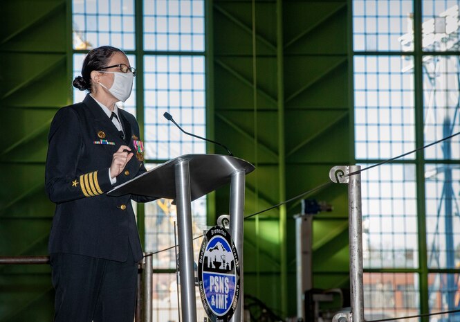 Puget Sound Naval Shipyard & Intermediate Maintenance Facility welcomed its new commander Dec. 2, 2020, at the shipyard in Bremerton, Washington, during a unique change of command ceremony that was arranged to protect participants and audience members from COVID-19. Capt. Jip Mosman relieved Capt. Dianna Wolfson during the ceremony in the historic Building 460. Vice Adm. William J. Galinis, commander, Naval Sea Systems Command, participated in the event via teleconference from NAVSEA headquarters in Washington, D.C. (PSNS & IMF photo by Wendy Hallmark)
