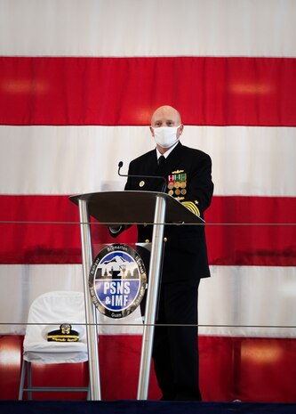 Puget Sound Naval Shipyard & Intermediate Maintenance Facility welcomed its new commander Dec. 2, 2020, at the shipyard in Bremerton, Washington, during a unique change of command ceremony that was arranged to protect participants and audience members from COVID-19. Capt. Jip Mosman relieved Capt. Dianna Wolfson during the ceremony in the historic Building 460. Vice Adm. William J. Galinis, commander, Naval Sea Systems Command, participated in the event via teleconference from NAVSEA headquarters in Washington, D.C. (PSNS & IMF photo by Wendy Hallmark)