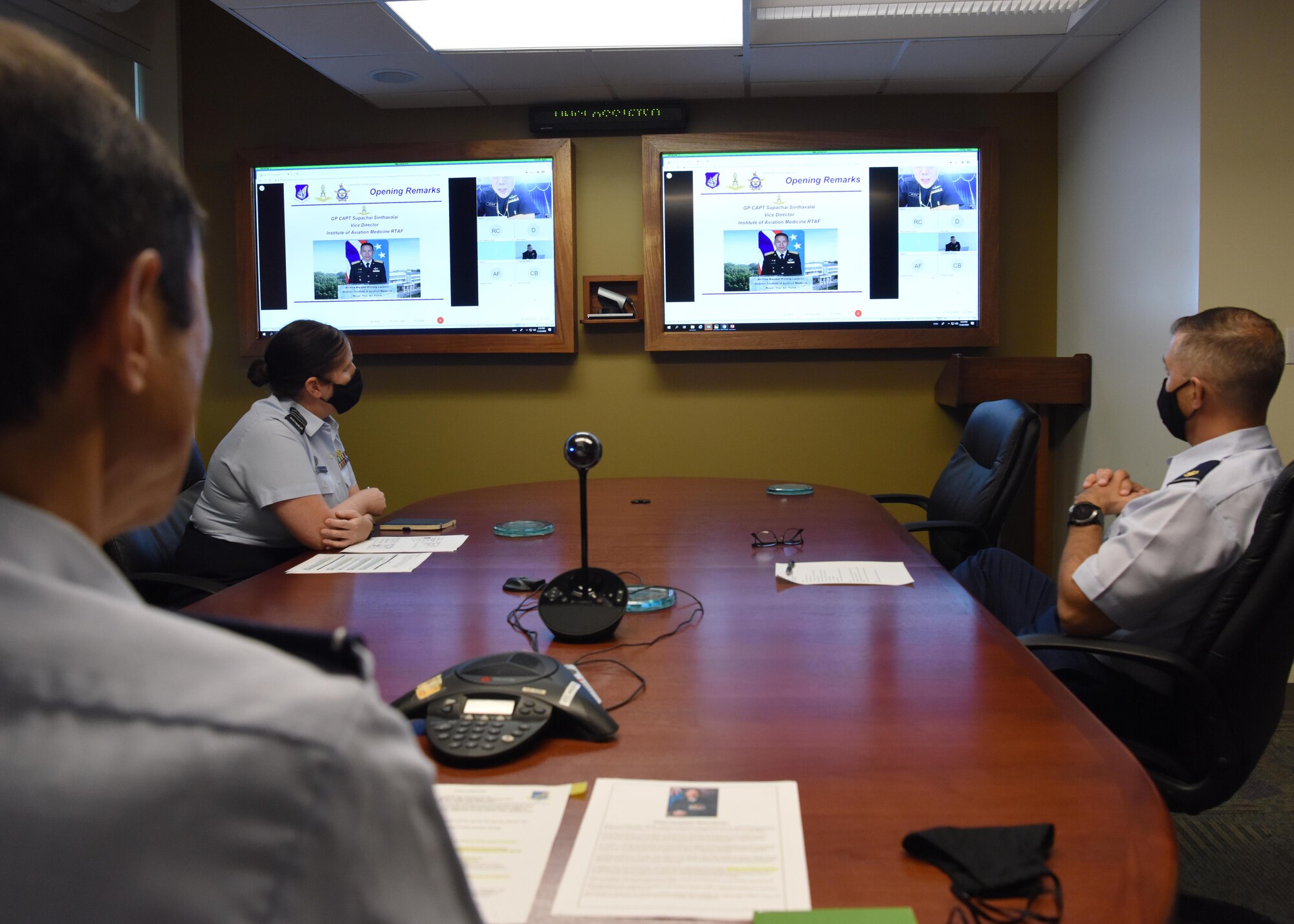 U.S. Air Force Col. Rudy Cachuela, left-center Pacific Air Forces command surgeon virtually hosts an Aerospace Medicine virtual knowledge exchange with medical experts from the Royal Australian Air Force and Royal Thai Air Force, at Joint Base Pearl Harbor-Hickam, Hawaii, Nov. 23, 2020.  The exchange focused on highlighting current best practices in aviation medicine and patient movement to enhance aircrew safety and patient care. (U.S. Air Force photo by Tech. Sgt. Zach Vaughn)