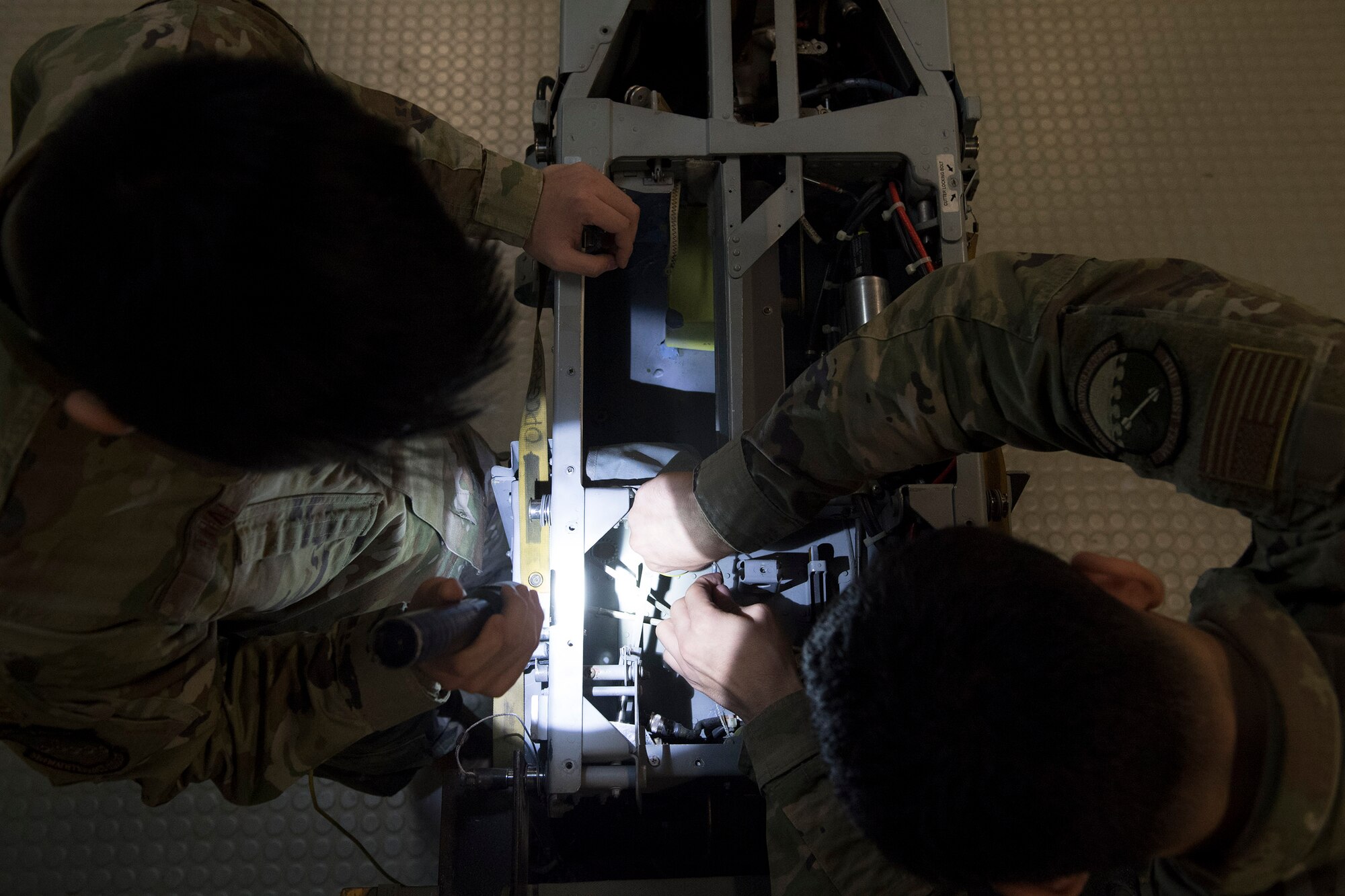 Maintainers assigned to the 51st Maintenance Squadron Egress systems shop inspect components on an A-10 Thunderbolt II ejection seat at Osan Air Base, Republic of Korea, Dec. 1, 2020. The Air Force Egress career field’s motto “We punch pilots out!” refers to the pilot’s ejection sequence during an in-flight emergency. (U.S. Air Force photo by Senior Airman Greg Nash)