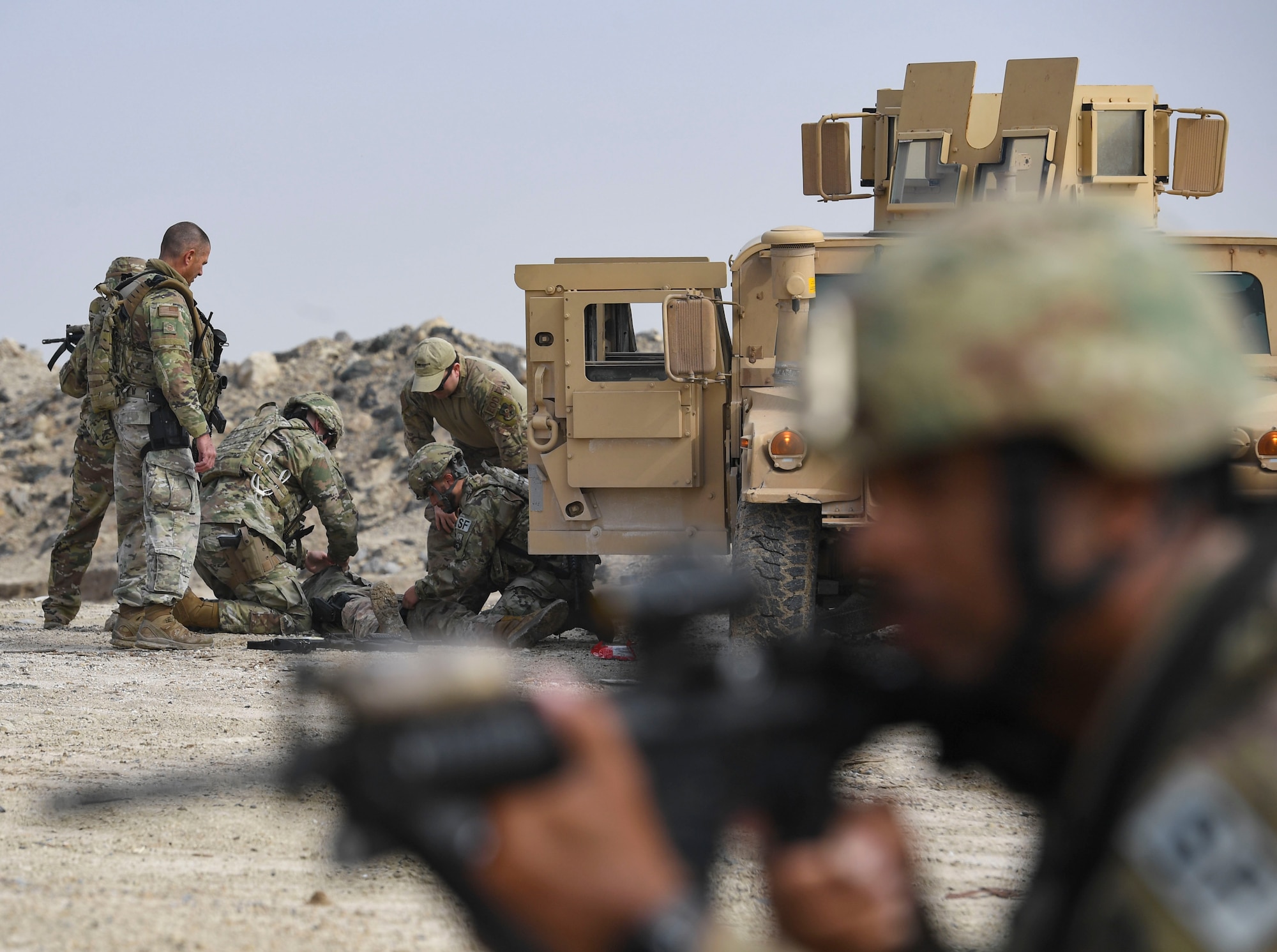 U.S. Air Force Airmen assigned to the 386th Expeditionary Security Forces Squadron provide medical care to a mock victim during an improvised explosive device and unexploded ordnance familiarization course at Ali Al Salem Air Base, Kuwait, Dec. 2, 2020.