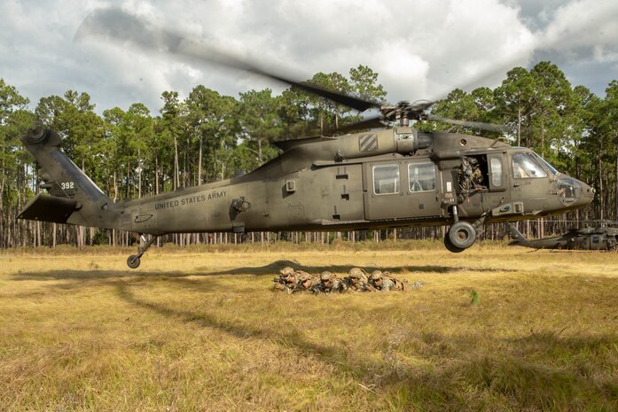 U.S. Marines provide security after exiting a U.S. Army UH-60M Black Hawk during exercise “Dogs of War” on Fort Stewart, Georgia, Nov. 4.