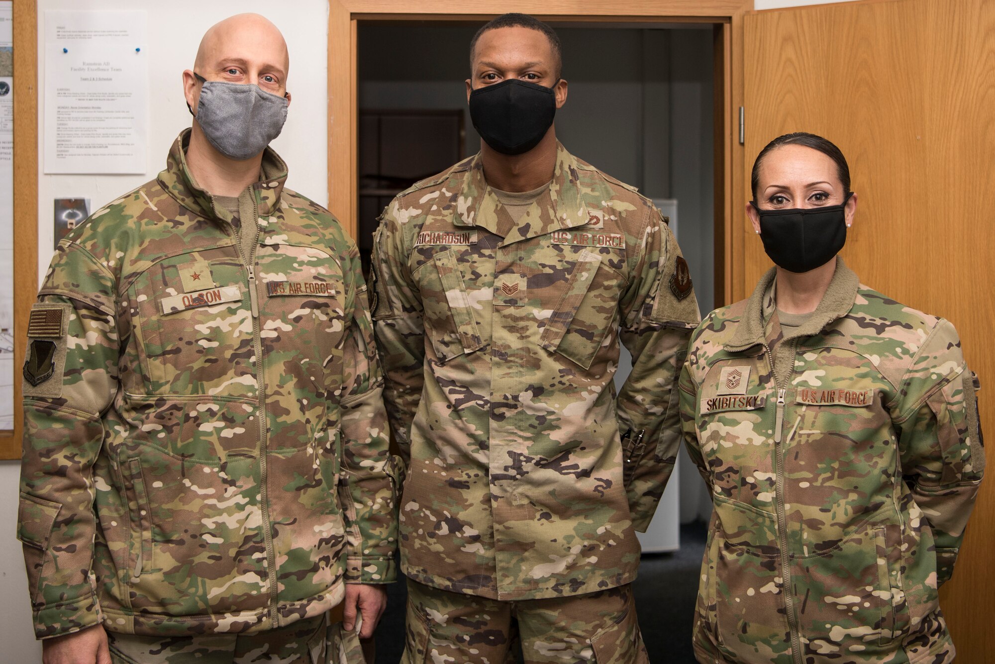 U.S. Air Force Brig. Gen. Joshua Olson, 86th Airlift Wing commander, left, poses for a photo with U.S. Air Force Staff Sgt. Marquette Richardson, 786th Civil Engineer Squadron facility excellence leadership team noncommissioned officer in charge, center, and 86th AW Command Chief Master Sgt. Hope Skibitsky, during an Airlifter of the Week ceremony.
