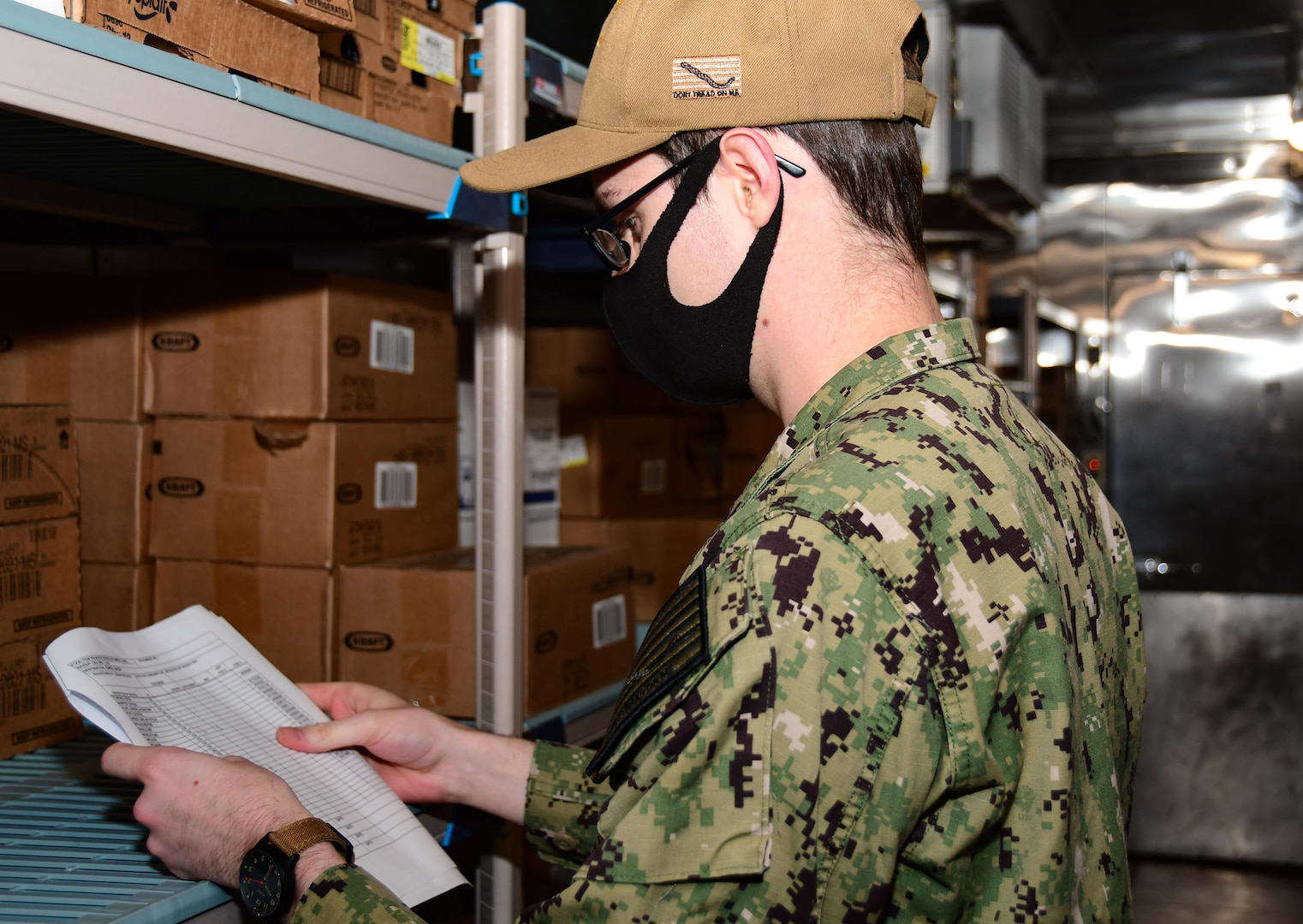 Culinary Specialist 2nd Class Jacob Owens, Naval Medical Center Portsmouth’s (NMCP) cargo leading petty officer, takes inventory in the fridge of the galley, Dec. 1.